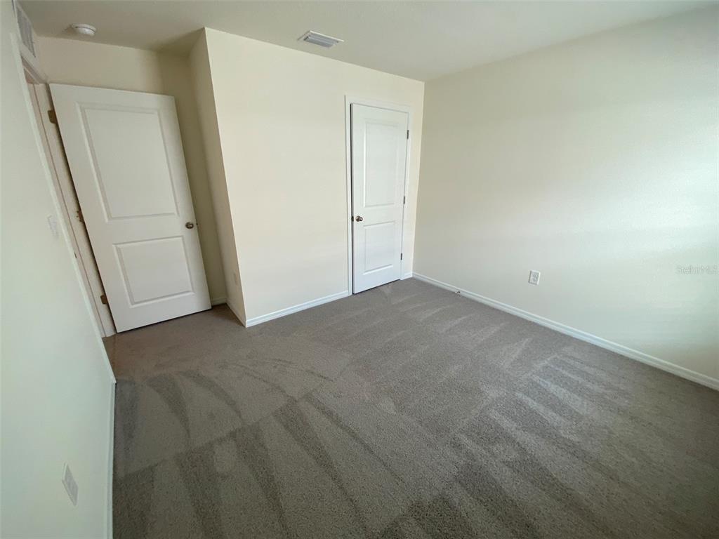 4961 Southwest 88th Place Ocala, FL 34476 - Photo 9 of 50 an empty room with closet