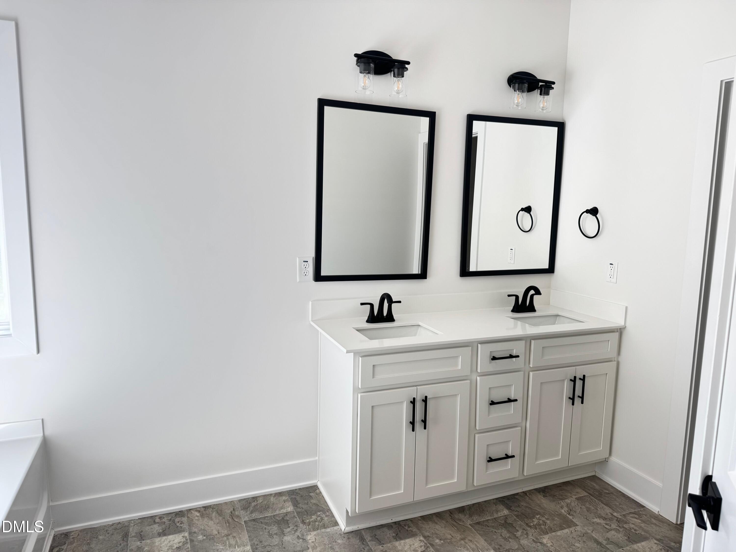 20 Streamline Court Lillington, NC 27546 - Photo 23 of 46 a bathroom with a toilet sink and mirror