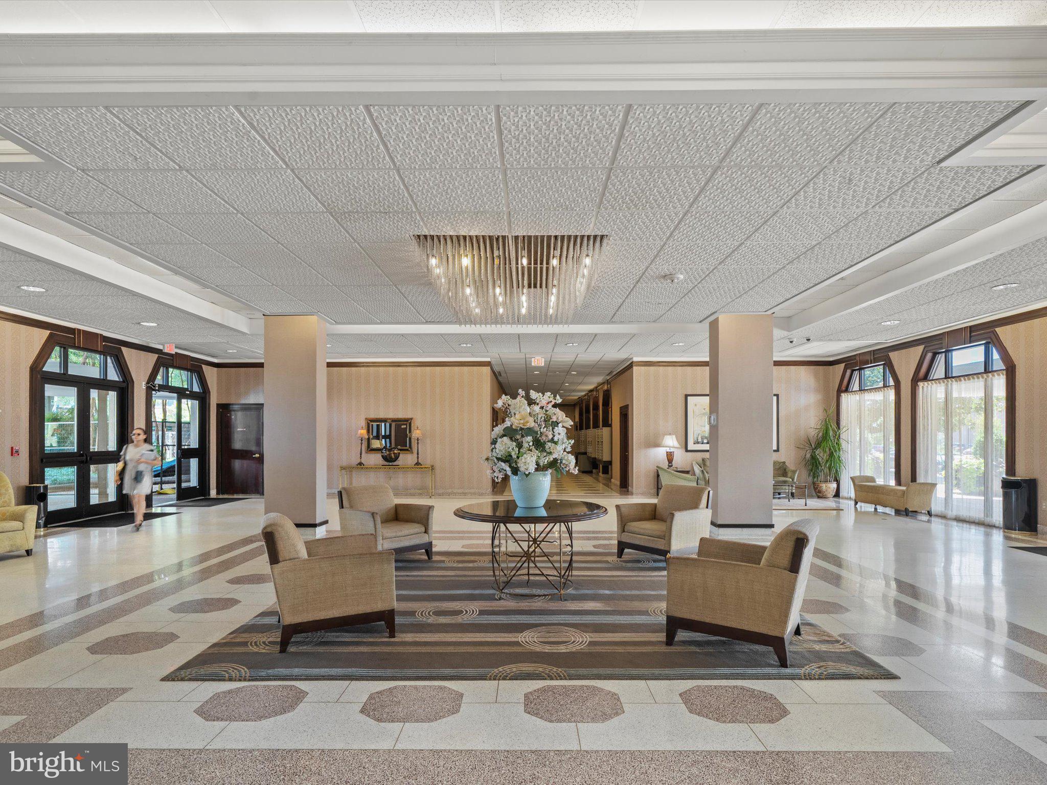 700 7th Street Southwest, Unit 430 Washington, DC 20024 - Photo 14 of 15 a living room with furniture and a chandelier