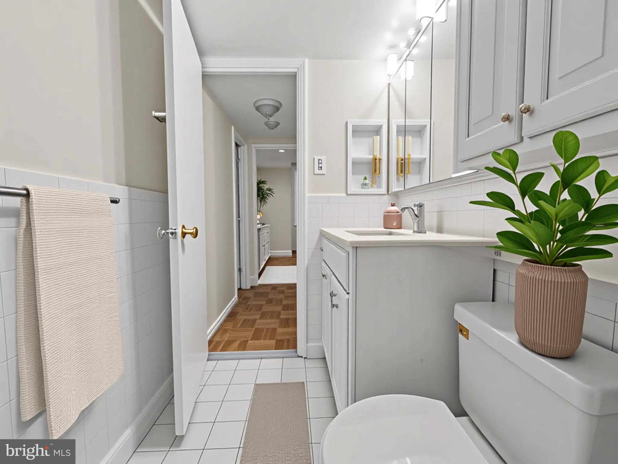 700 7th Street Southwest, Unit 430 Washington, DC 20024 - Photo 8 of 15 a bathroom with a sink toilet and shower