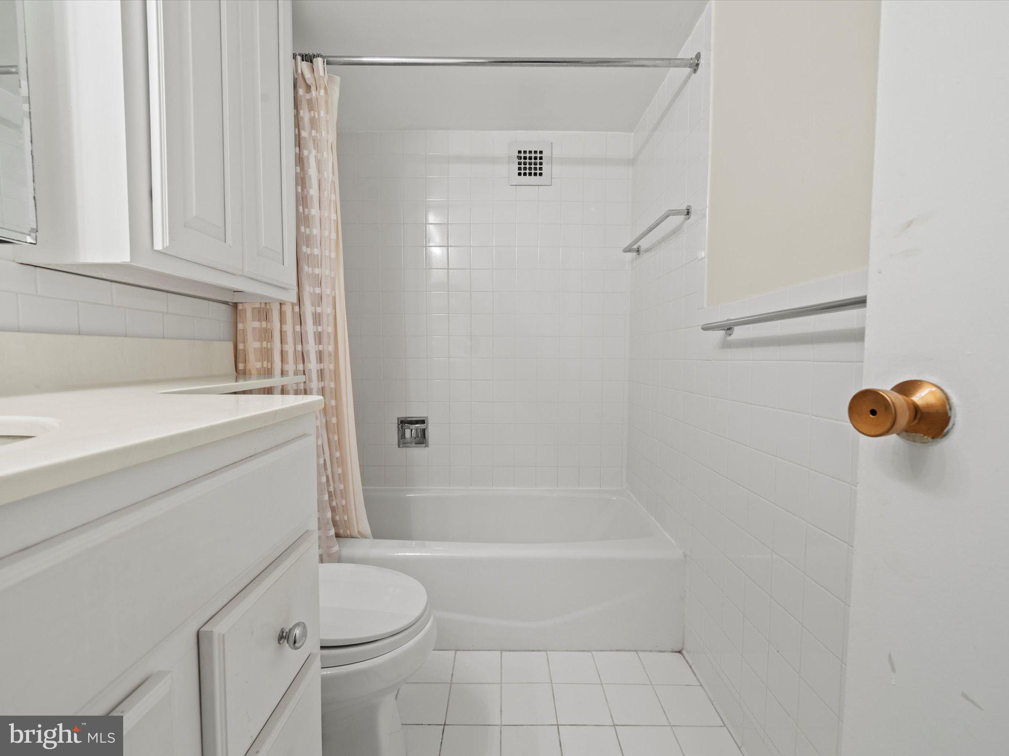 700 7th Street Southwest, Unit 430 Washington, DC 20024 - Photo 9 of 15 a bathroom with a sink a toilet and shower