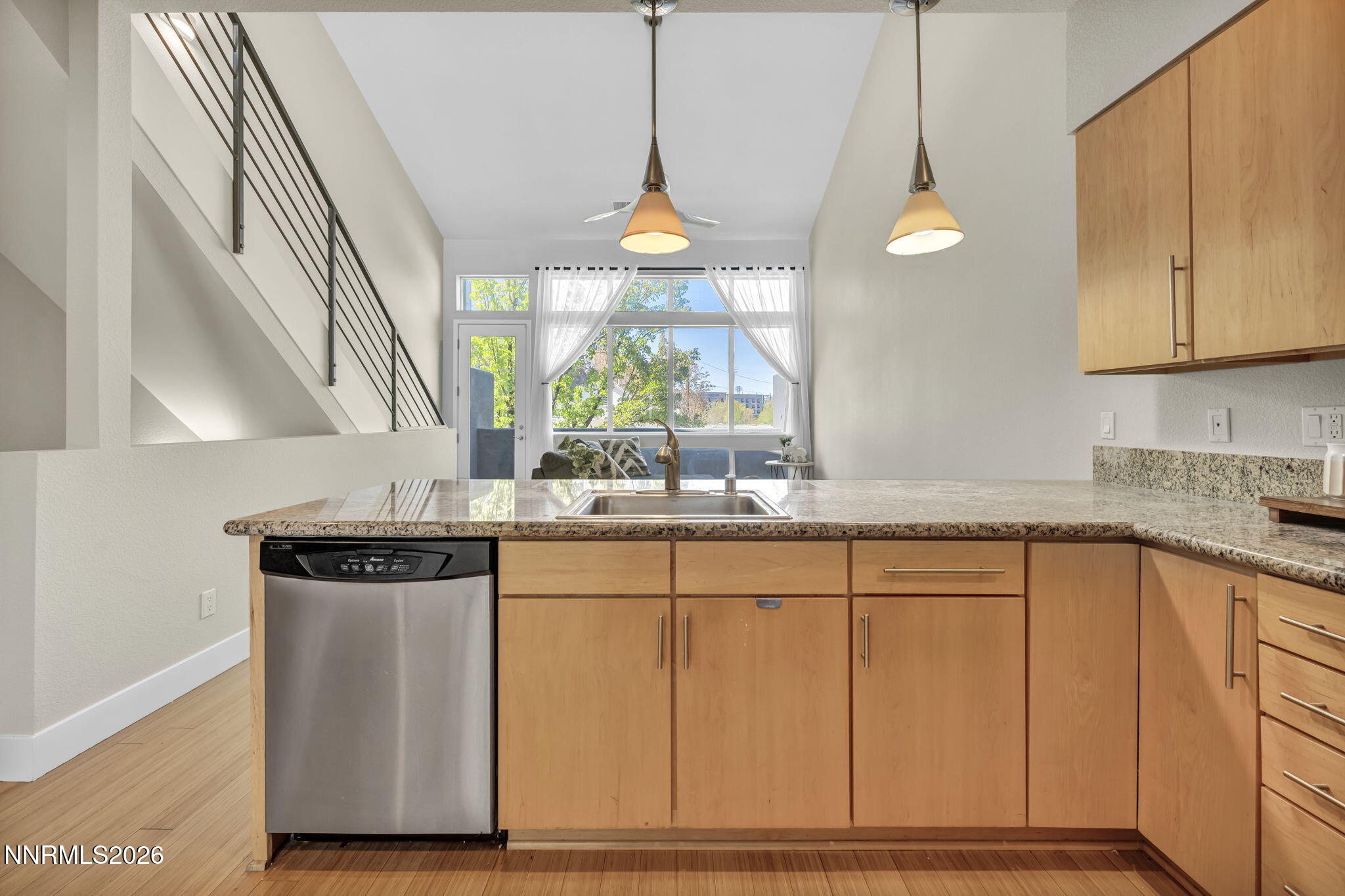 326 State Street Reno, NV 89501 - Photo 25 of 49 a kitchen with stainless steel appliances granite countertop a stove a sink and a microwave