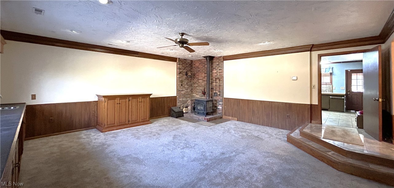 7855 Mulberry Road Chesterland, OH 44026 - Photo 17 of 46 Sprawling Family Room, great for entertaining, with a wood burning stove and a brick firewall.