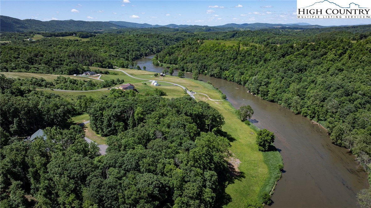 24 Moxley Ridge Road Independence, VA 24348 - Photo 4 of 20 a view of a lush green forest with a building in the background