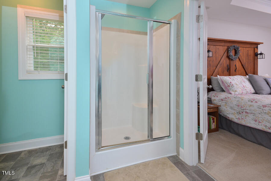 195 Timberwind Road Franklinton, NC 27525 - Photo 24 of 28 a bedroom with a bed and a window