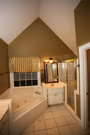 a kitchen with a sink a stove and cabinets