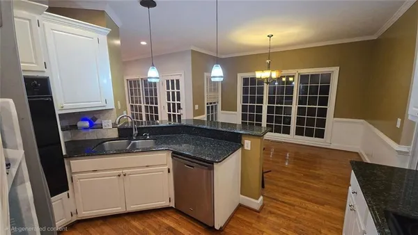 a kitchen with a sink stove and cabinets