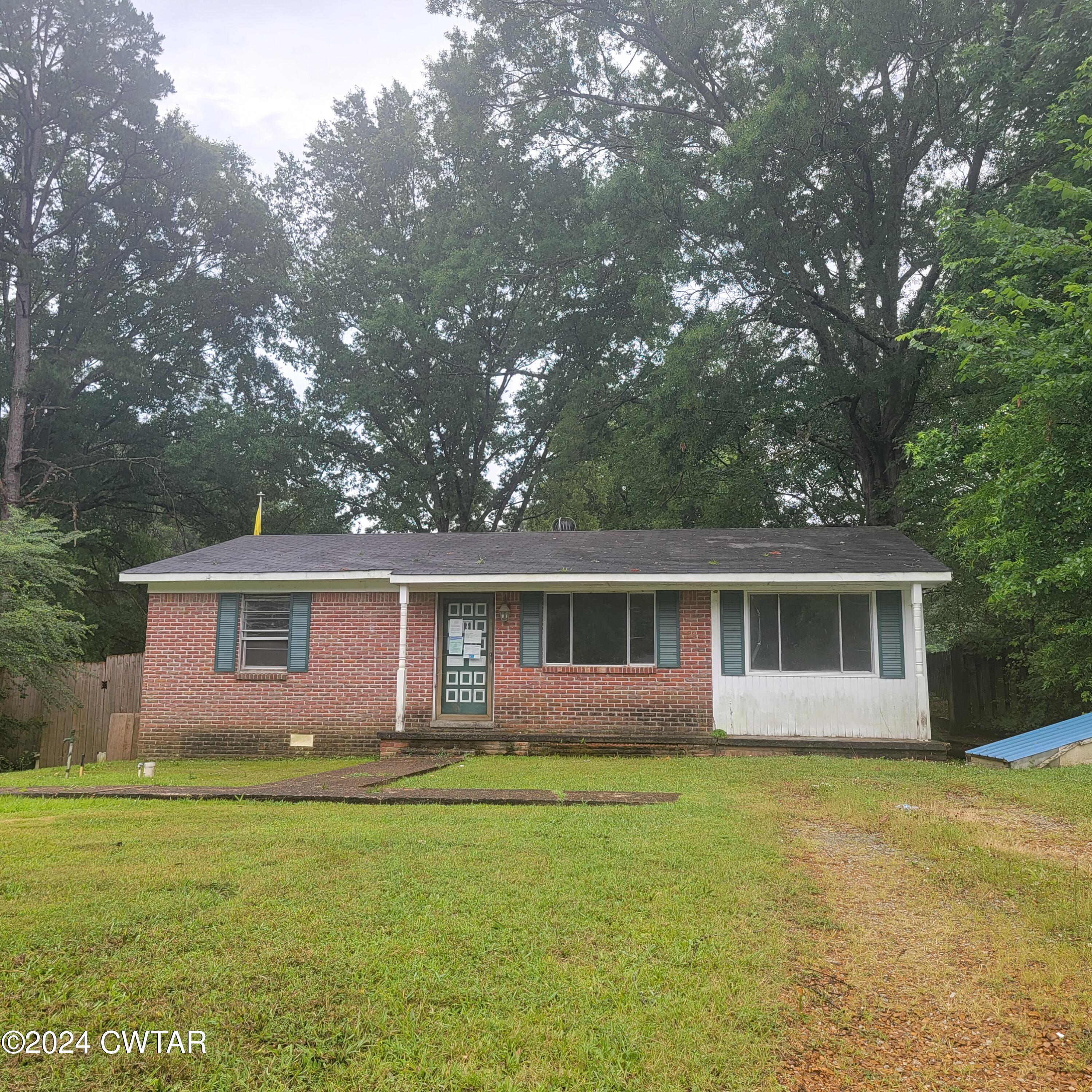 650 Old Finger Road Henderson, TN 38340 - Photo 1 of 19 a front view of house with yard and green space
