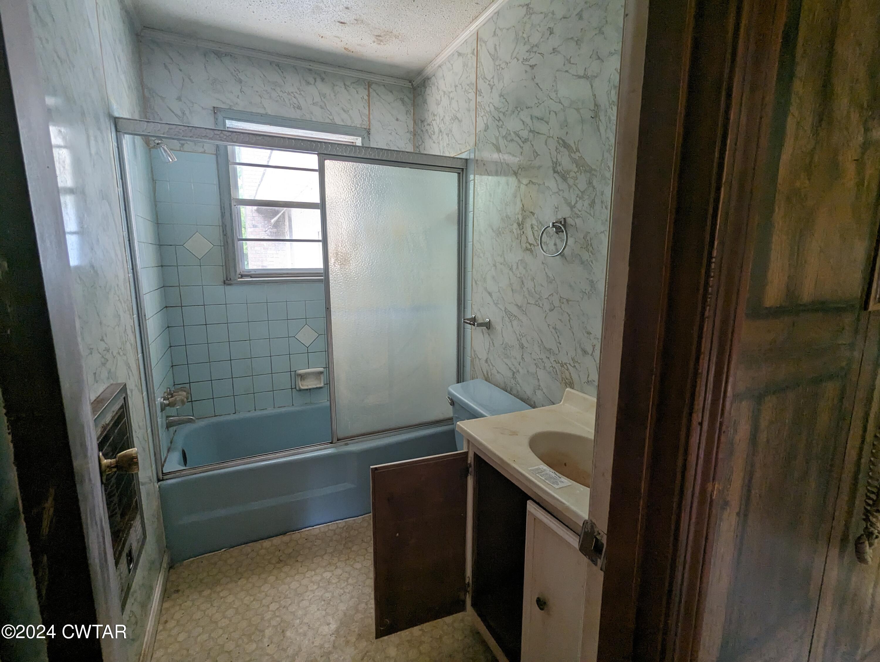 650 Old Finger Road Henderson, TN 38340 - Photo 11 of 19 a bathroom with a bathtub and shower