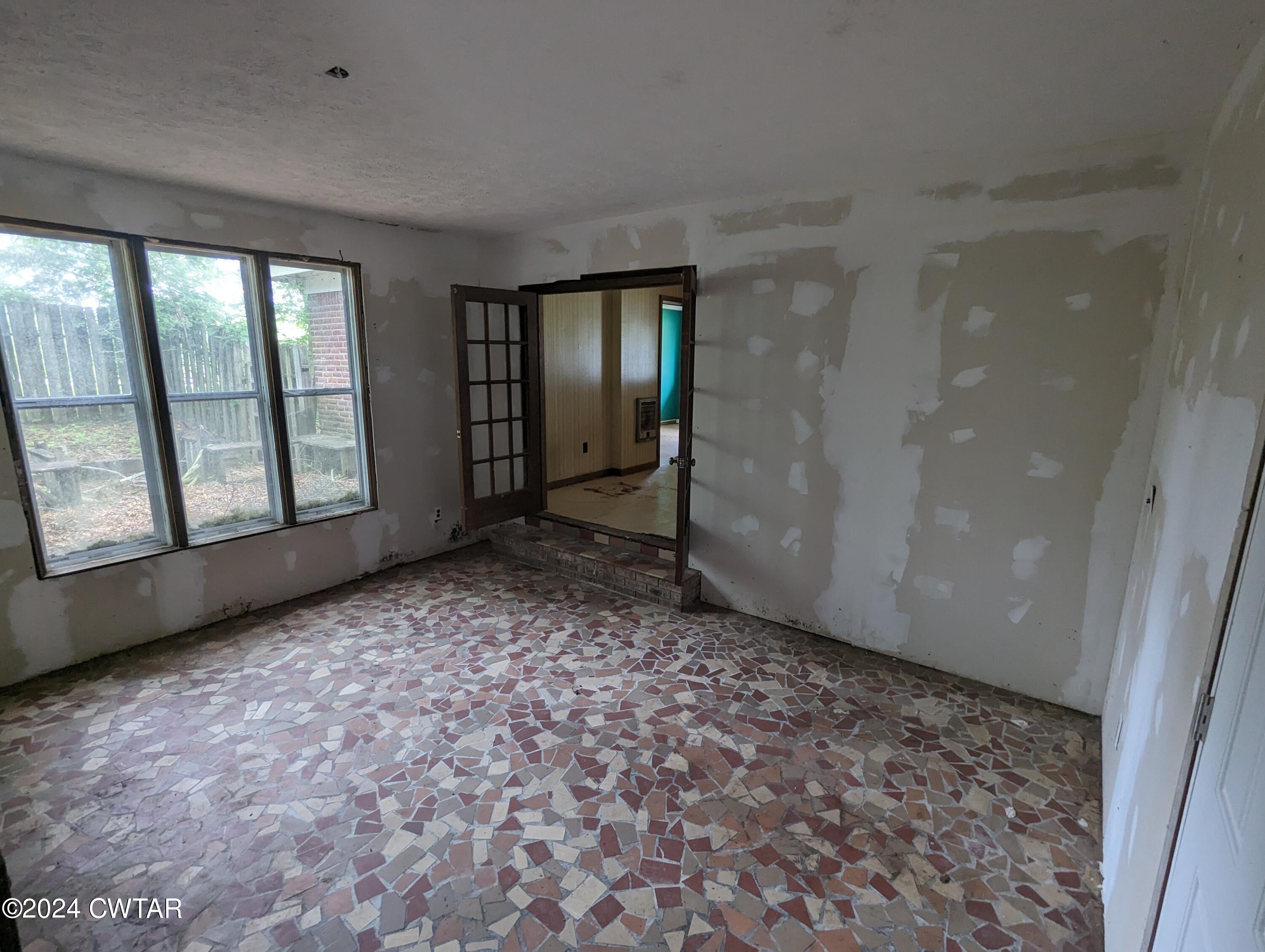 650 Old Finger Road Henderson, TN 38340 - Photo 16 of 19 an empty room with windows
