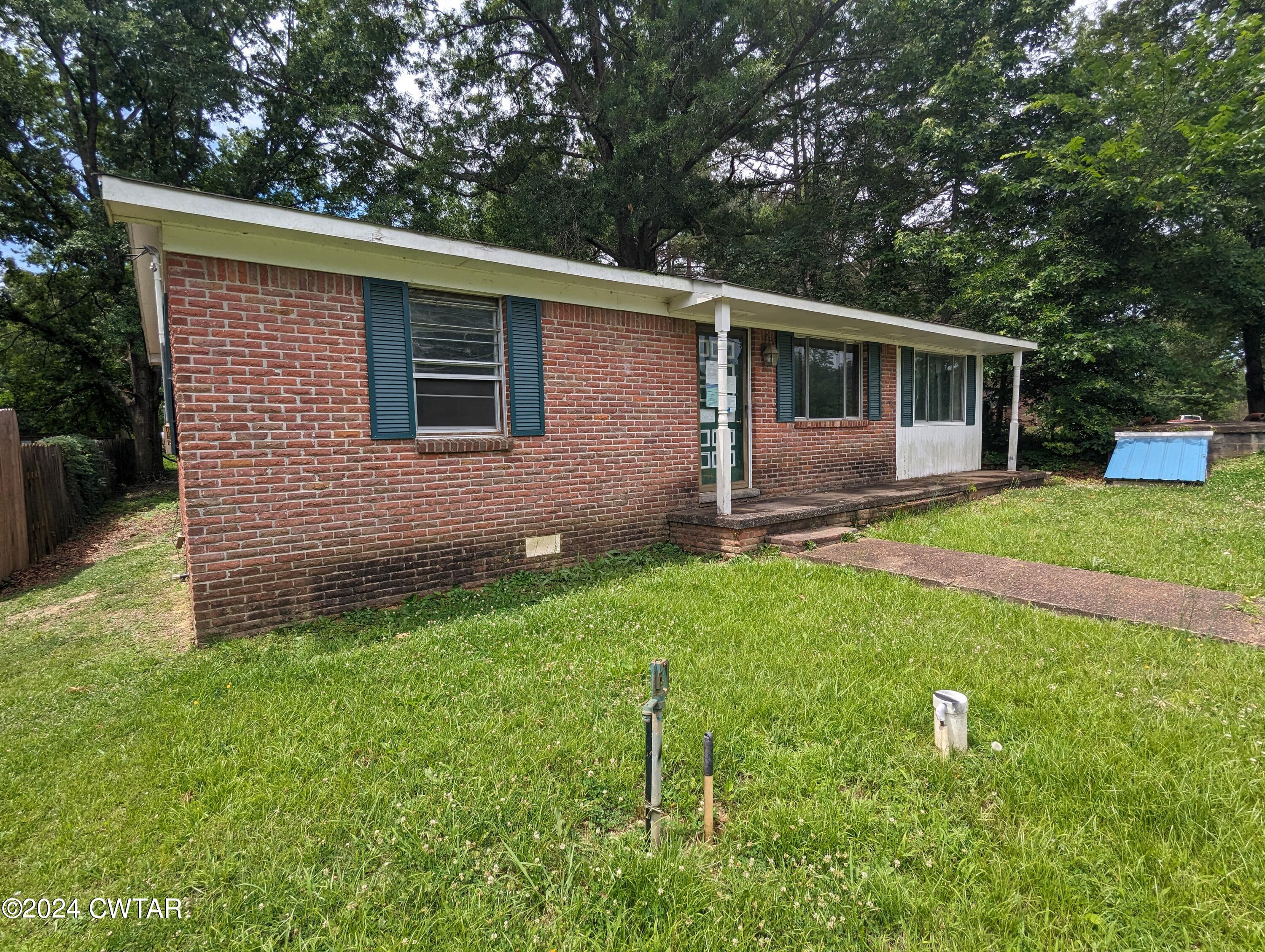 650 Old Finger Road Henderson, TN 38340 - Photo 4 of 19 a backyard of a house with seating space