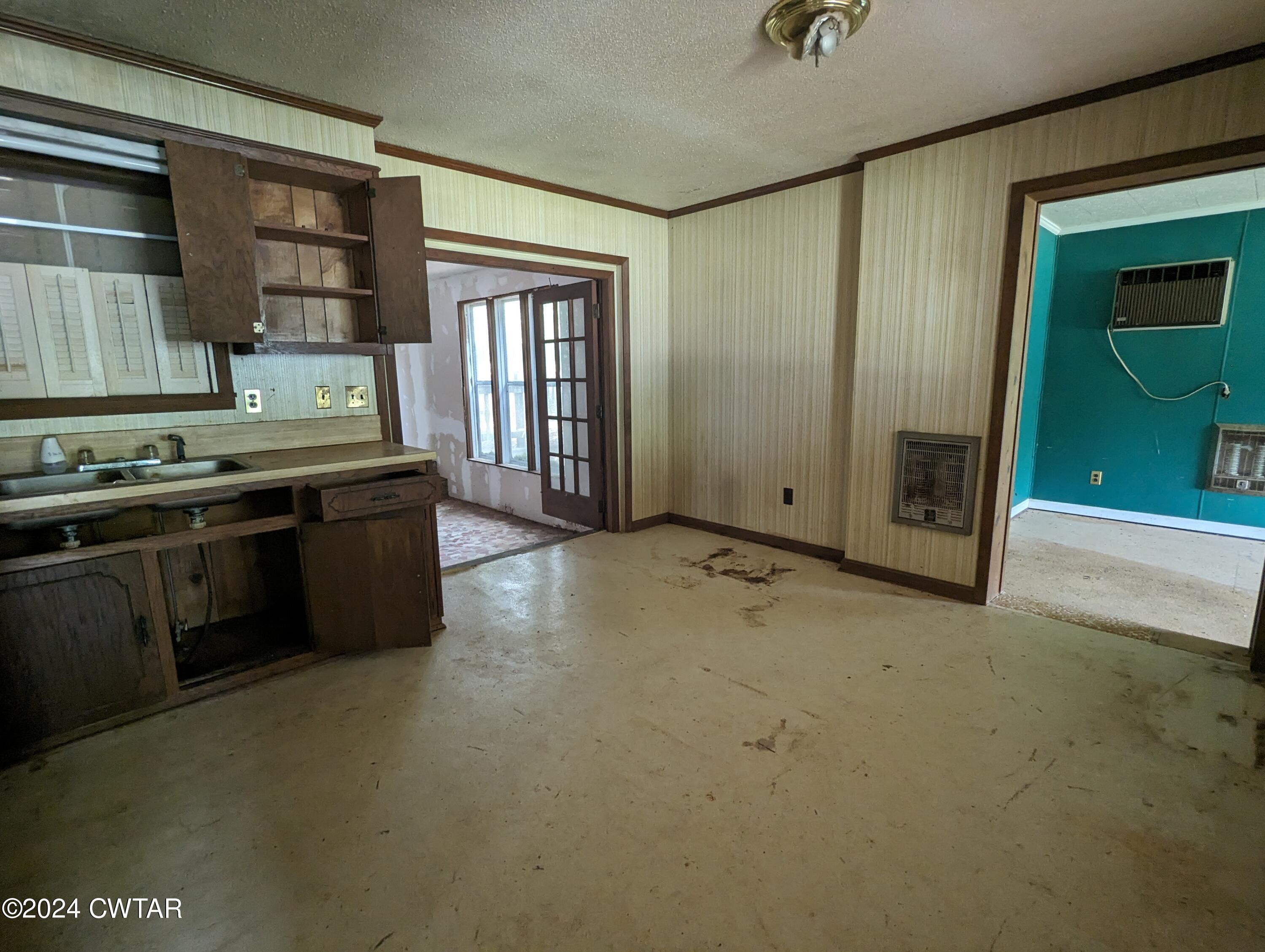 650 Old Finger Road Henderson, TN 38340 - Photo 8 of 19 an empty room with windows