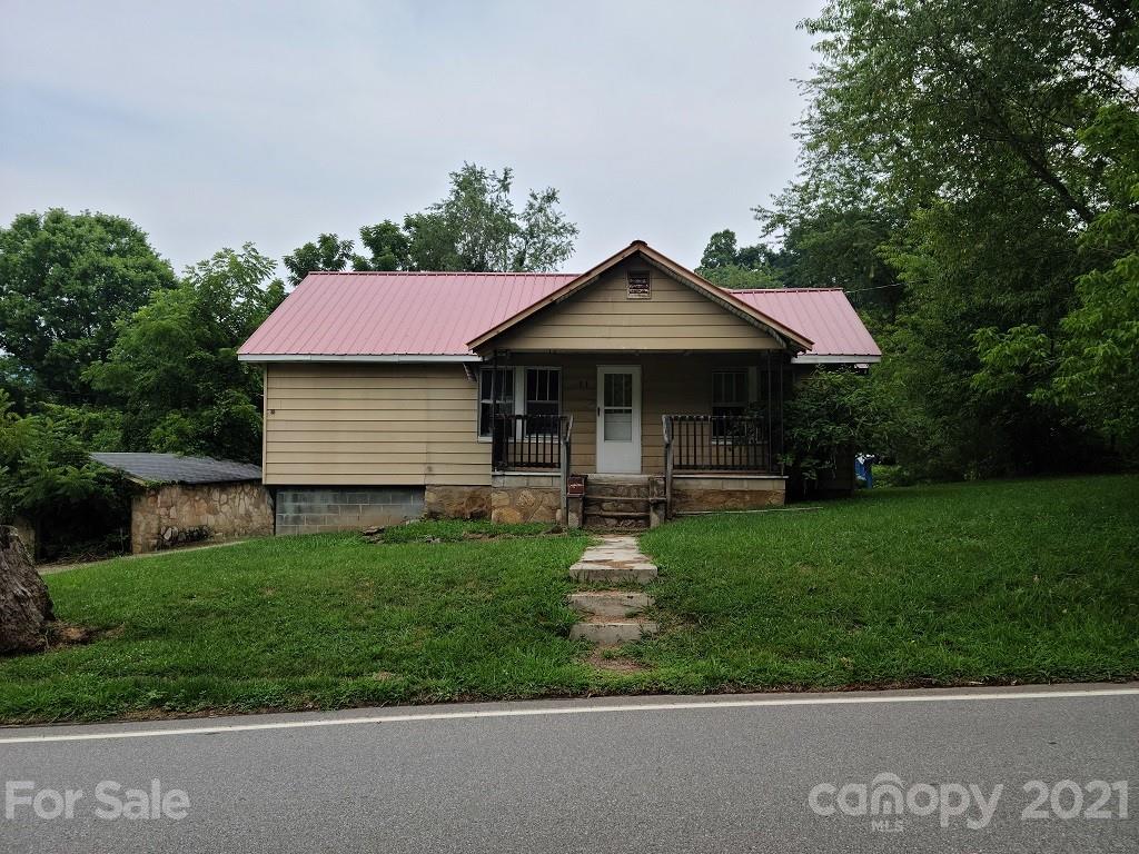 109 Lee Road Clyde, NC 28721 - Photo 1 of 7 a front view of a house with a yard