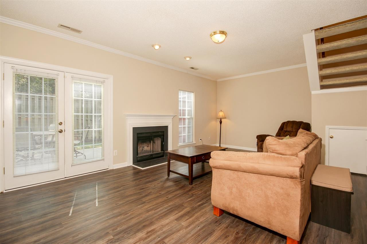 4402 Still Pines Drive Raleigh, NC 27613 - Photo 9 of 25 Cozy on up to the wood burning fireplace during our NC winter months. Living Room