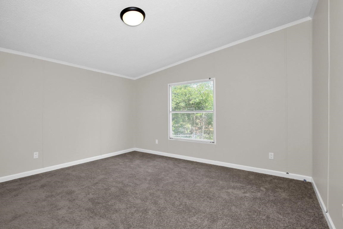 1357 Heritage Way Cameron, NC 28326 - Photo 15 of 28 an empty room with windows and closet