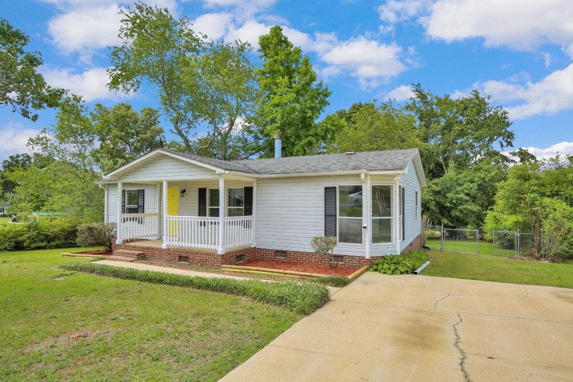 1357 Heritage Way Cameron, NC 28326 - Photo 2 of 28 a front view of a house with a yard
