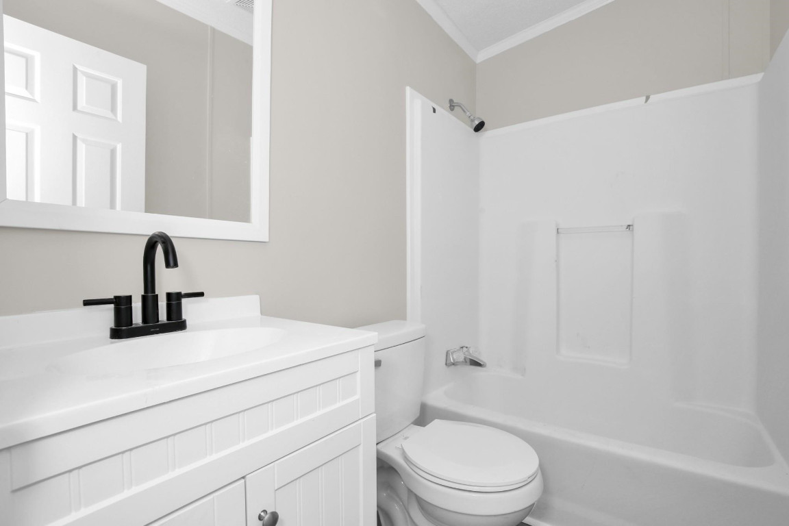 1357 Heritage Way Cameron, NC 28326 - Photo 22 of 28 a bathroom with a sink a toilet and shower
