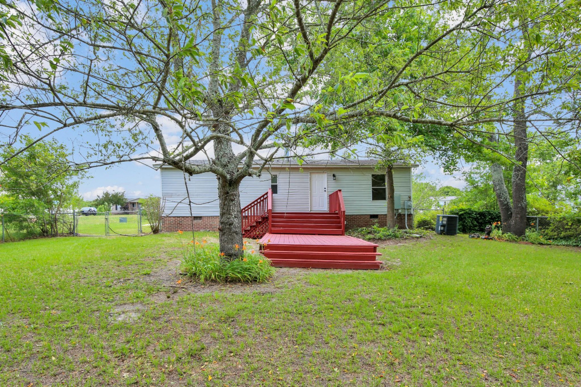 1357 Heritage Way Cameron, NC 28326 - Photo 23 of 28 a front view of a house with a yard