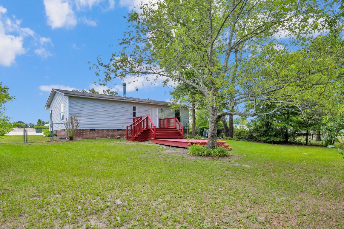 1357 Heritage Way Cameron, NC 28326 - Photo 24 of 28 a view of a house with a big yard and a large tree