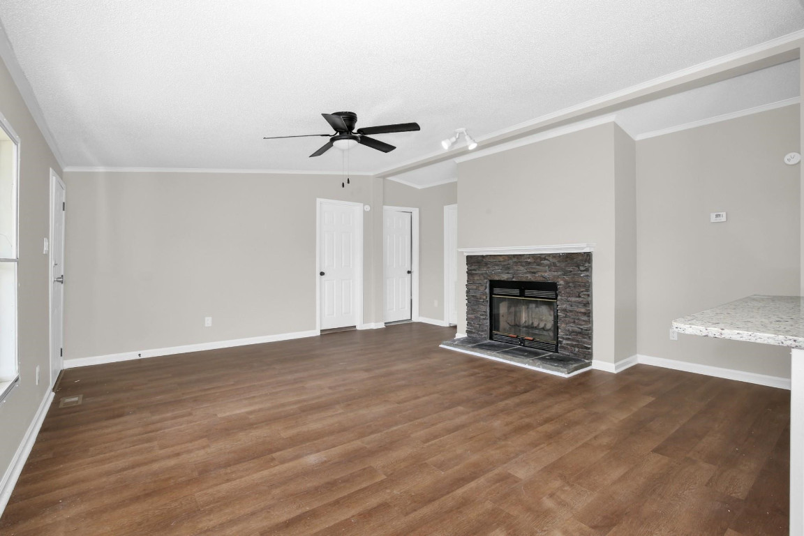 1357 Heritage Way Cameron, NC 28326 - Photo 5 of 28 a view of empty room with wooden floor and fireplace