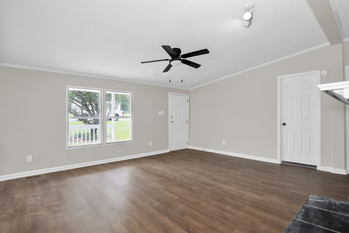 1357 Heritage Way Cameron, NC 28326 - Photo 7 of 28 wooden floor in an empty room with a window