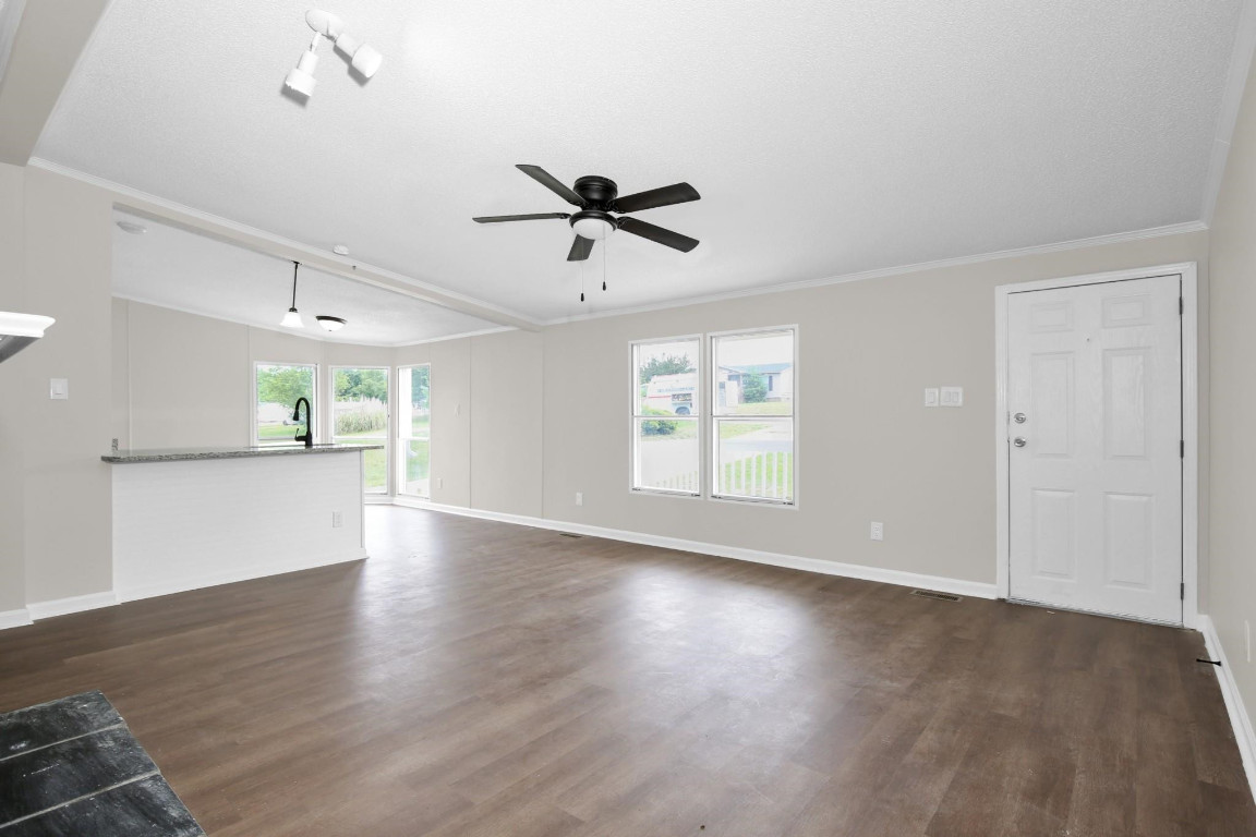 1357 Heritage Way Cameron, NC 28326 - Photo 8 of 28 wooden floor in an empty room with a window