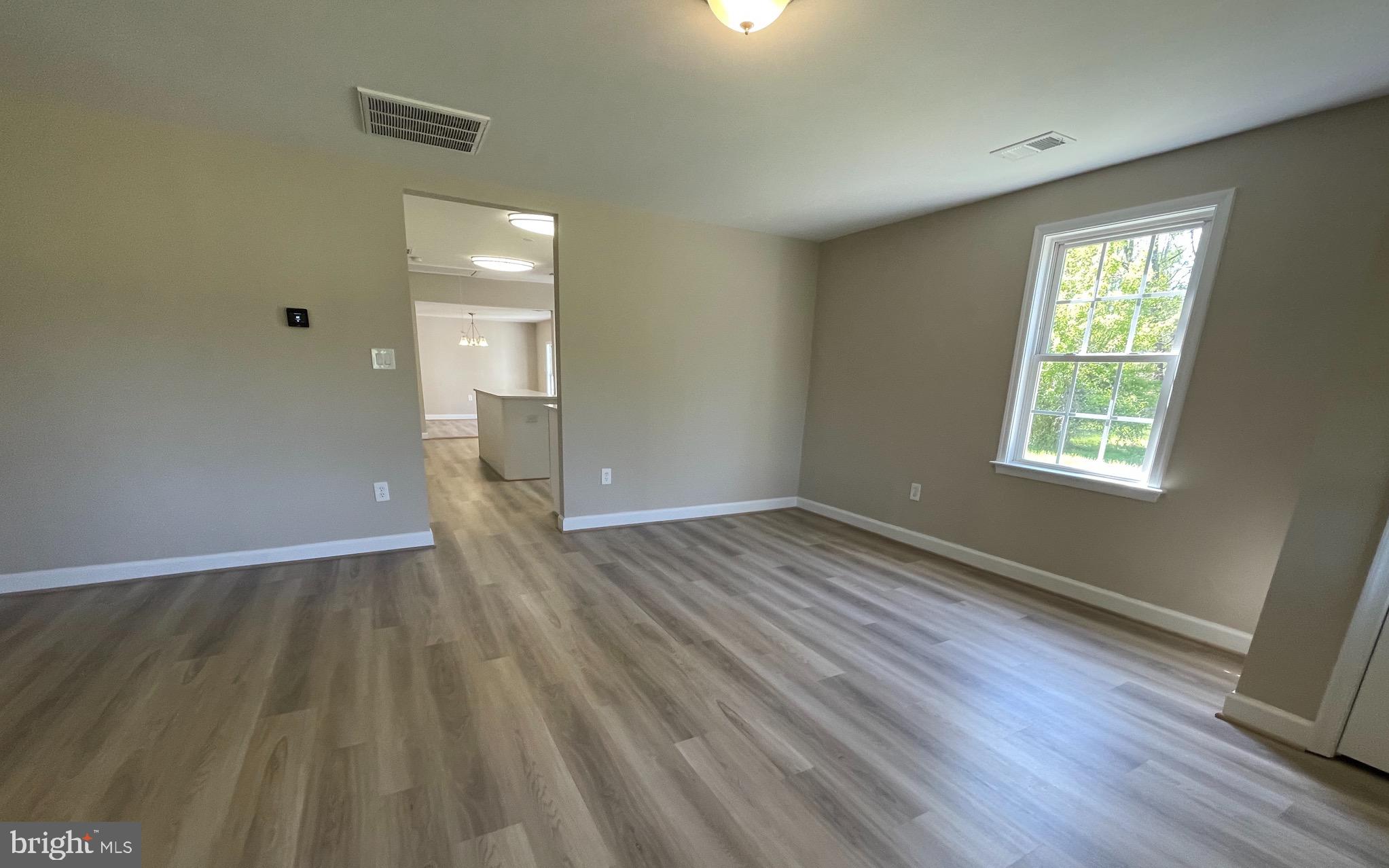 5831 Ridge Road Spotsylvania, VA 22551 - Photo 3 of 32 Entry to large living area with LVP.