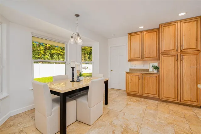 a kitchen with stainless steel appliances granite countertop a sink and cabinets