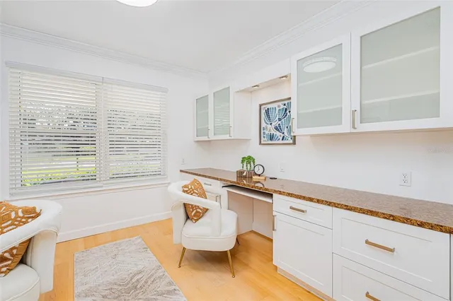 a view of a livingroom with furniture and a potted plant