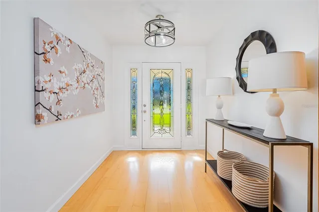 a view of a room with windows and wooden floor