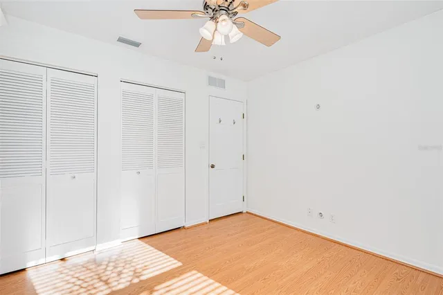 a bathroom with a sink a mirror a toilet and a shower