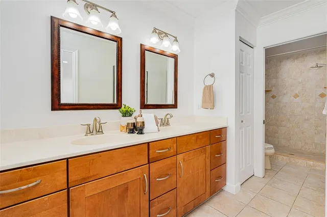 a bathroom with a double vanity sink and a mirror