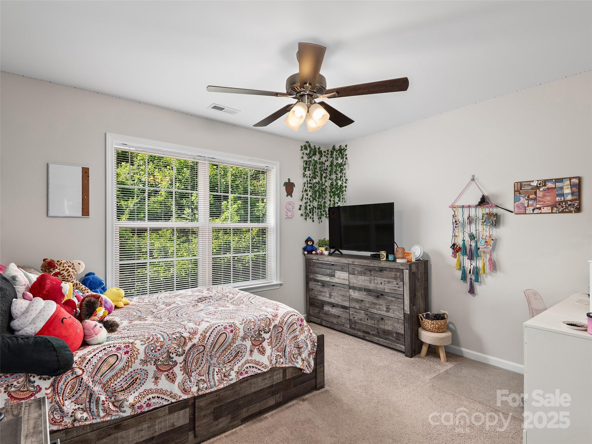 178 Black River Road Fletcher, NC 28732 - Photo 16 of 19 a bedroom with a bed and a flat screen tv
