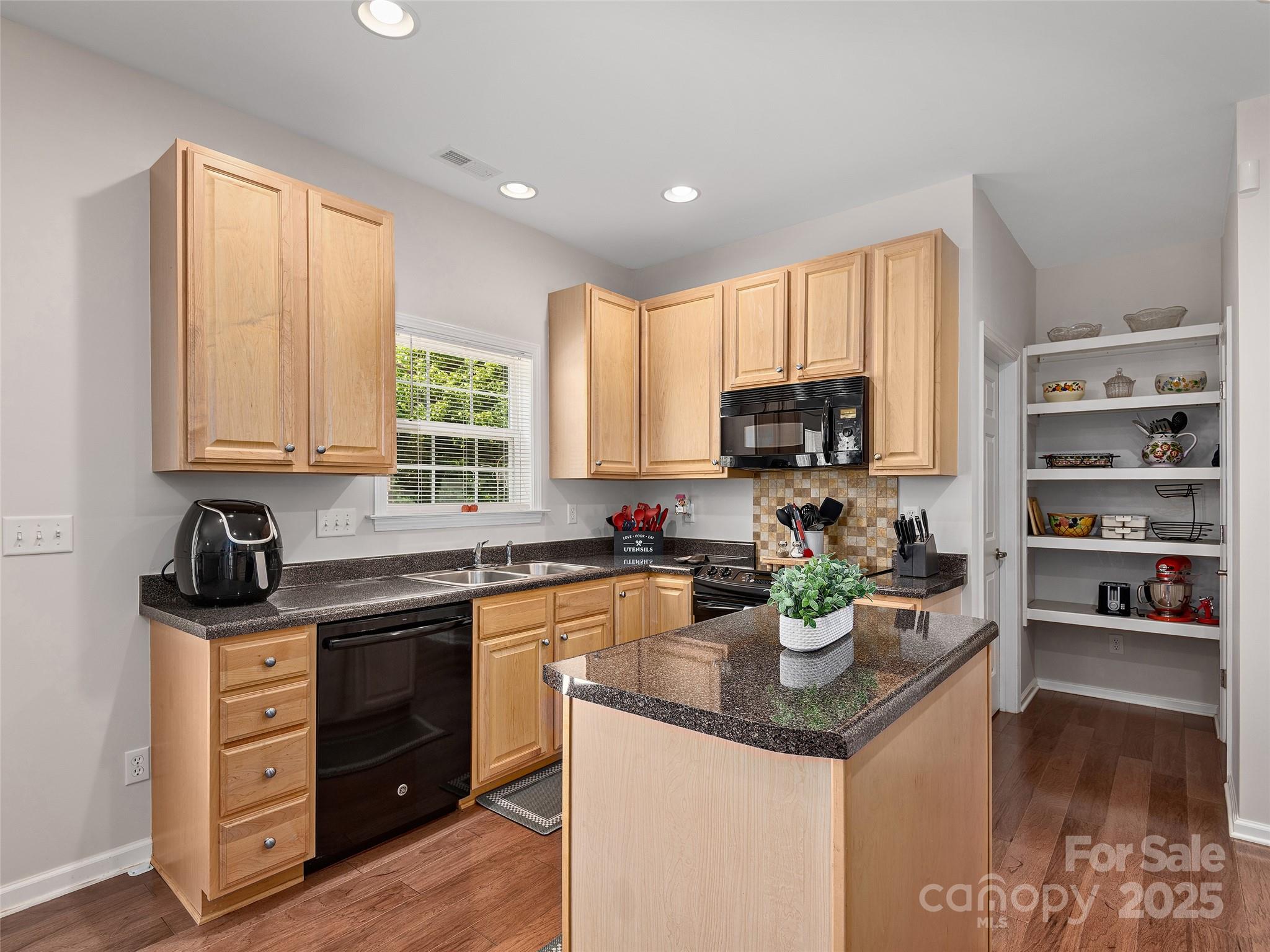 178 Black River Road Fletcher, NC 28732 - Photo 6 of 19 a kitchen with stainless steel appliances granite countertop a stove a sink and a microwave