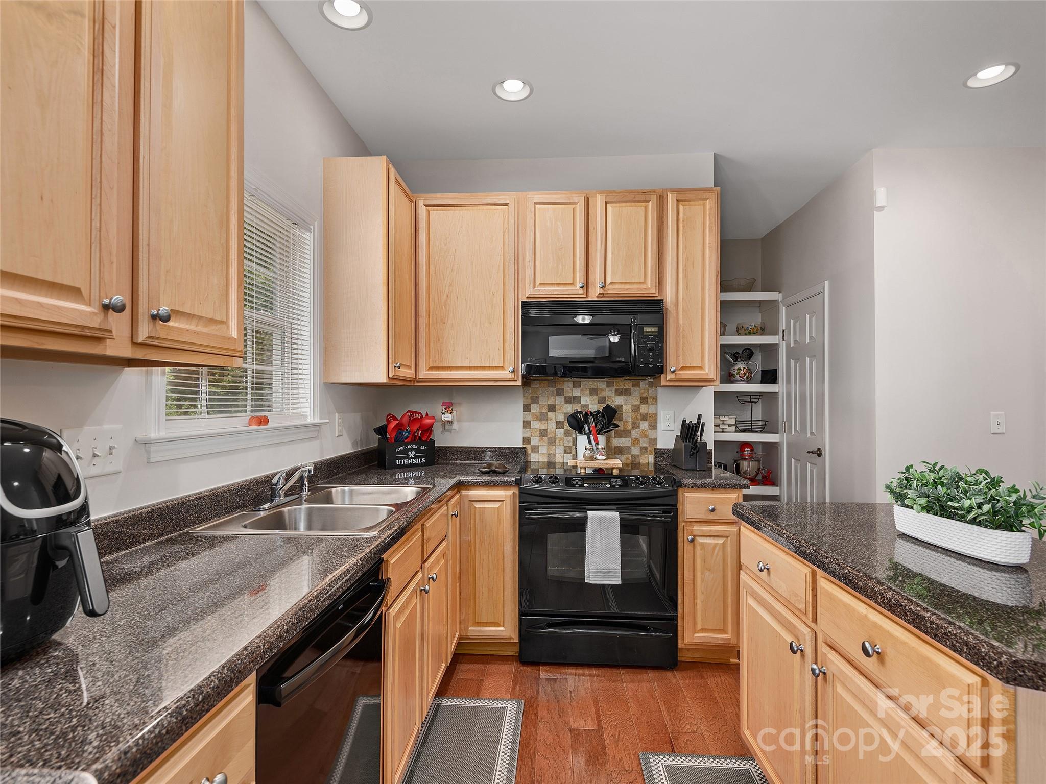 178 Black River Road Fletcher, NC 28732 - Photo 7 of 19 a kitchen with stainless steel appliances granite countertop a sink stove and cabinets