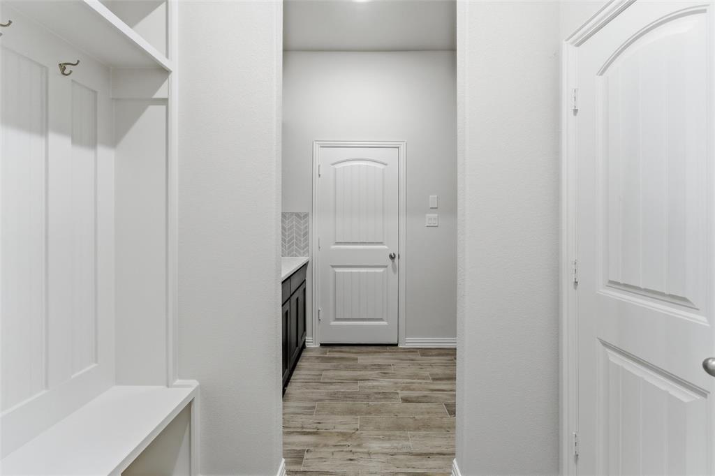 119 Hillview Trail Decatur, TX 76234 - Photo 16 of 30 Entryway featuring built-in white cabinetry with storage, coat hooks, and bench seating