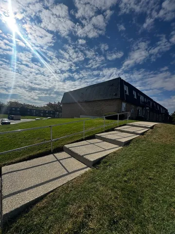 a view of parking with cars parked