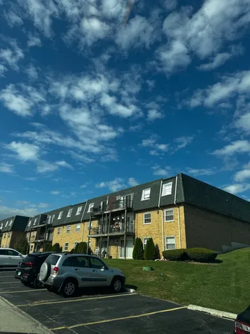 a kitchen with granite countertop stainless steel appliances and wooden cabinets