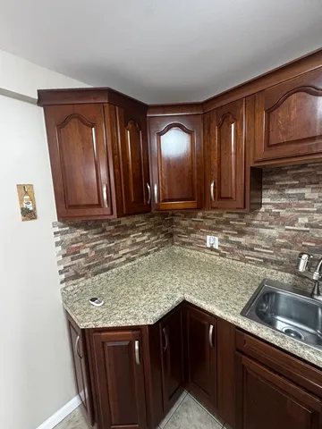 a view of wooden floor and a window in an empty room