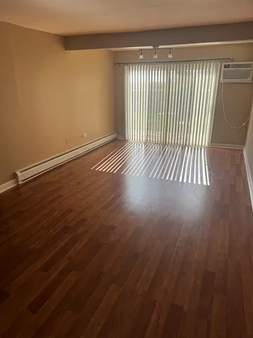 a view of a livingroom with wooden floor