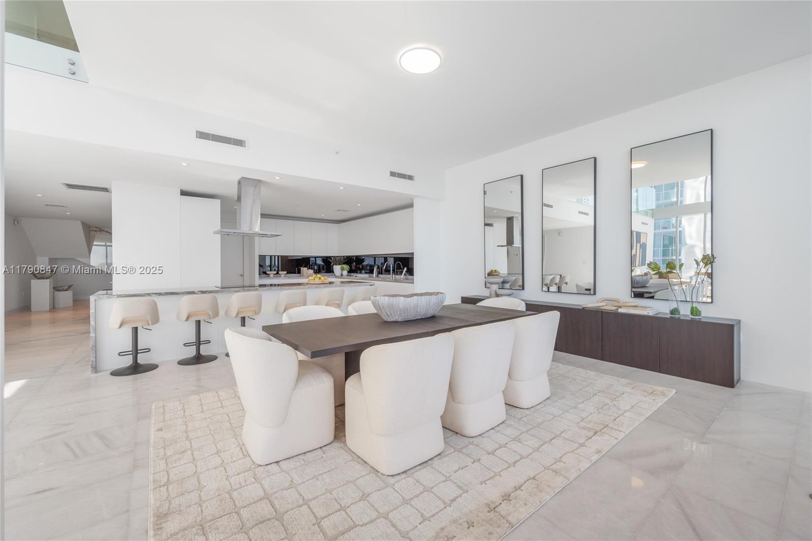 700 Northeast 26th Terrace, Unit TH403 Miami, FL 33137 - Photo 12 of 85 a large white kitchen with a large window