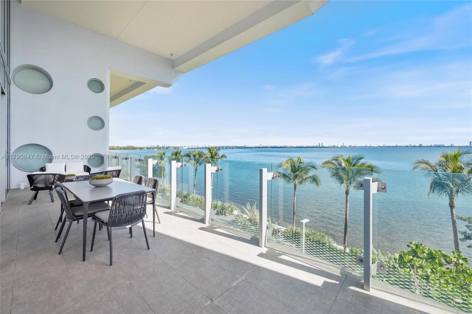 700 Northeast 26th Terrace, Unit TH403 Miami, FL 33137 - Photo 15 of 85 a dining room with furniture and floor to ceiling window