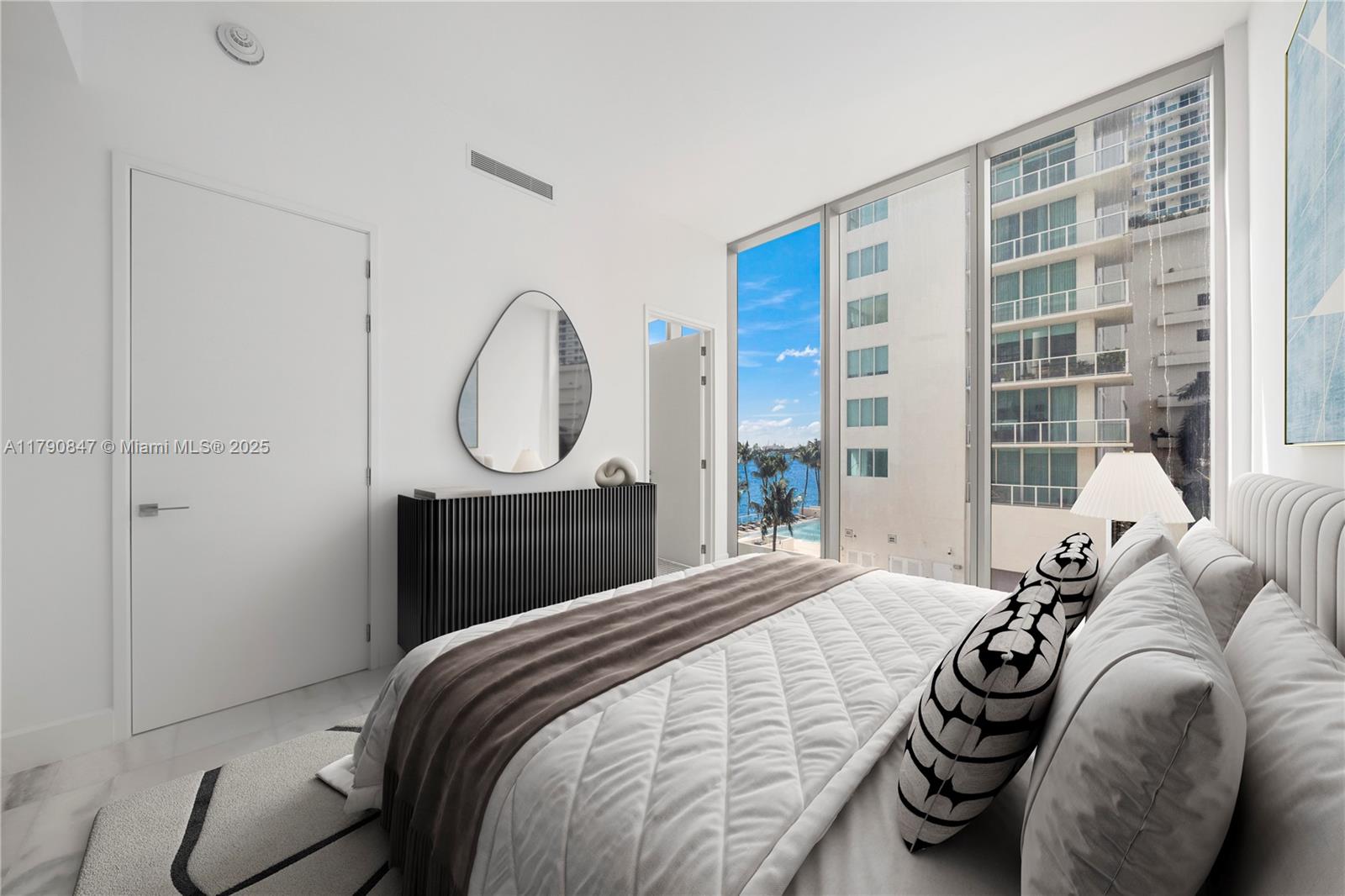 700 Northeast 26th Terrace, Unit TH403 Miami, FL 33137 - Photo 29 of 85 a bedroom with a bed and a window