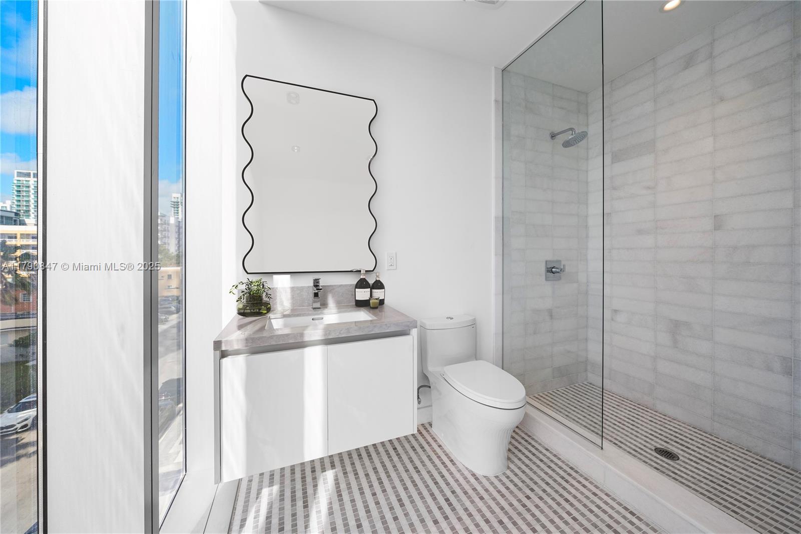 700 Northeast 26th Terrace, Unit TH403 Miami, FL 33137 - Photo 34 of 85 a bathroom with a toilet and a sink