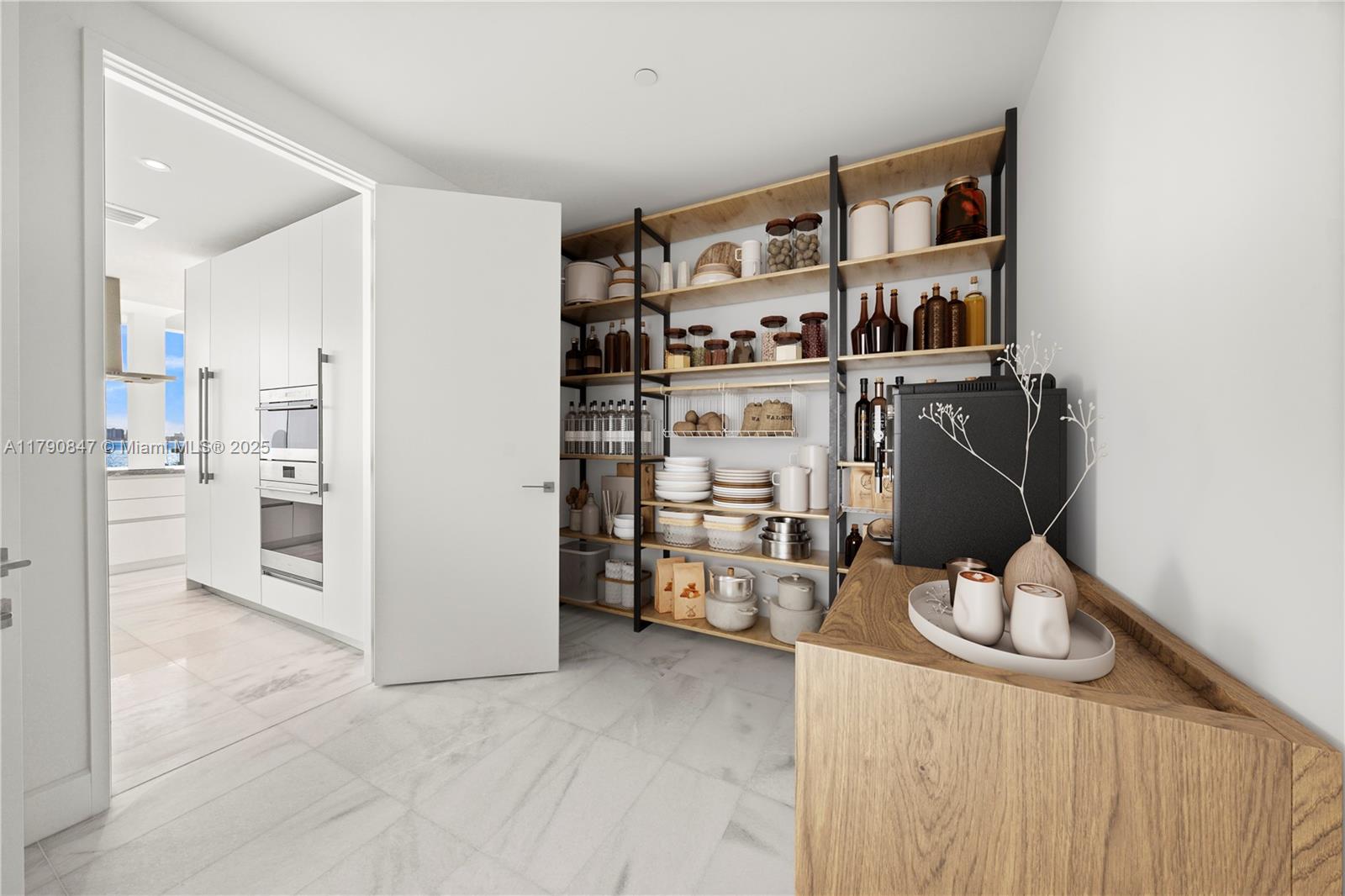 700 Northeast 26th Terrace, Unit TH403 Miami, FL 33137 - Photo 6 of 85 a view of a kitchen with fridge and workspace