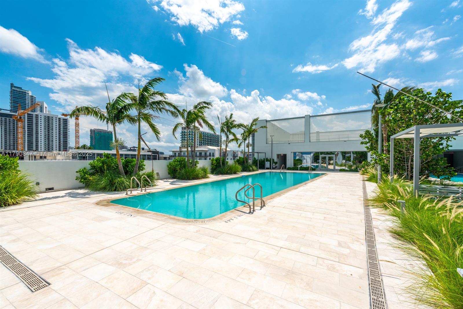 700 Northeast 26th Terrace, Unit TH403 Miami, FL 33137 - Photo 78 of 85 a view of a house with a swimming pool
