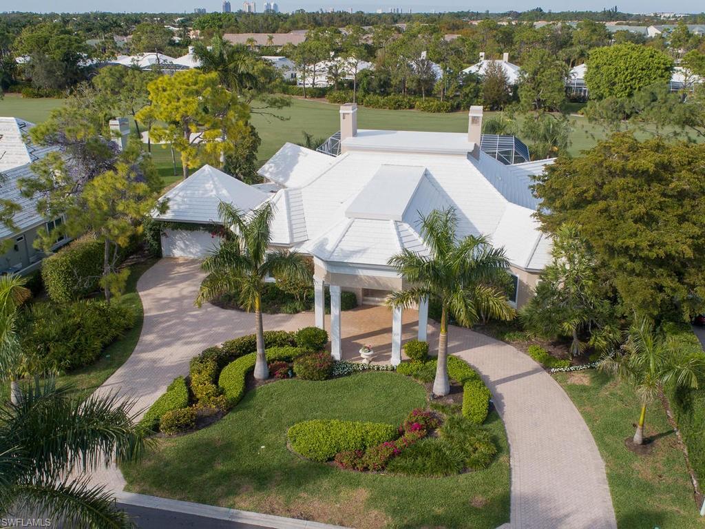 771 Brentwood Point Naples, FL 34110 - Photo 1 of 31 an aerial view of a house with a garden and lake view