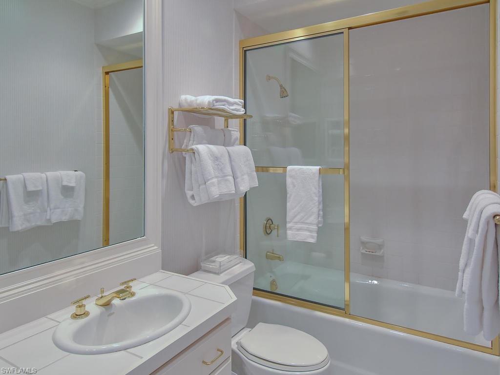 771 Brentwood Point Naples, FL 34110 - Photo 21 of 31 a bathroom with a sink toilet and shower