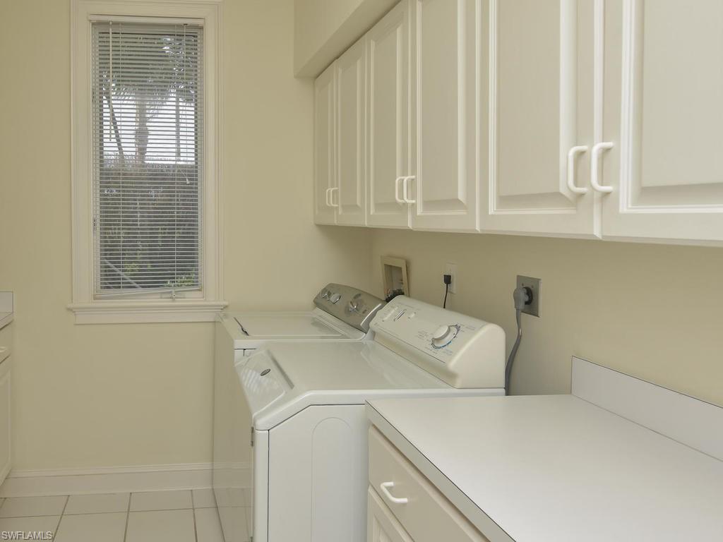 771 Brentwood Point Naples, FL 34110 - Photo 23 of 31 a utility room with dryer and washer