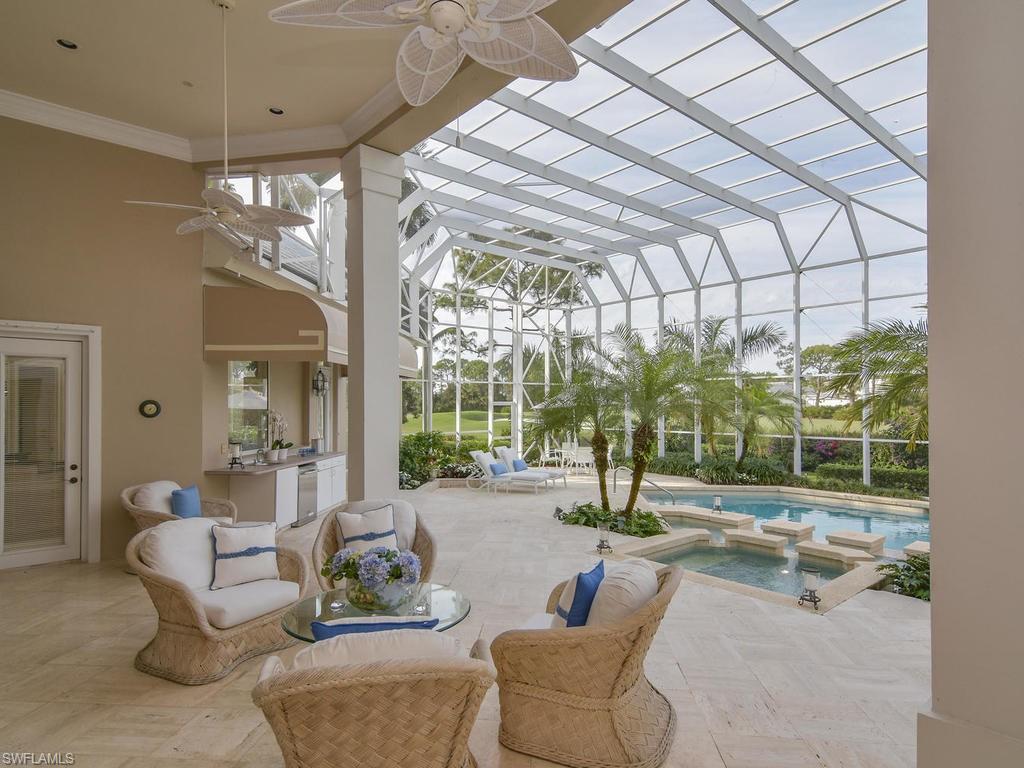 771 Brentwood Point Naples, FL 34110 - Photo 25 of 31 a living room with patio area